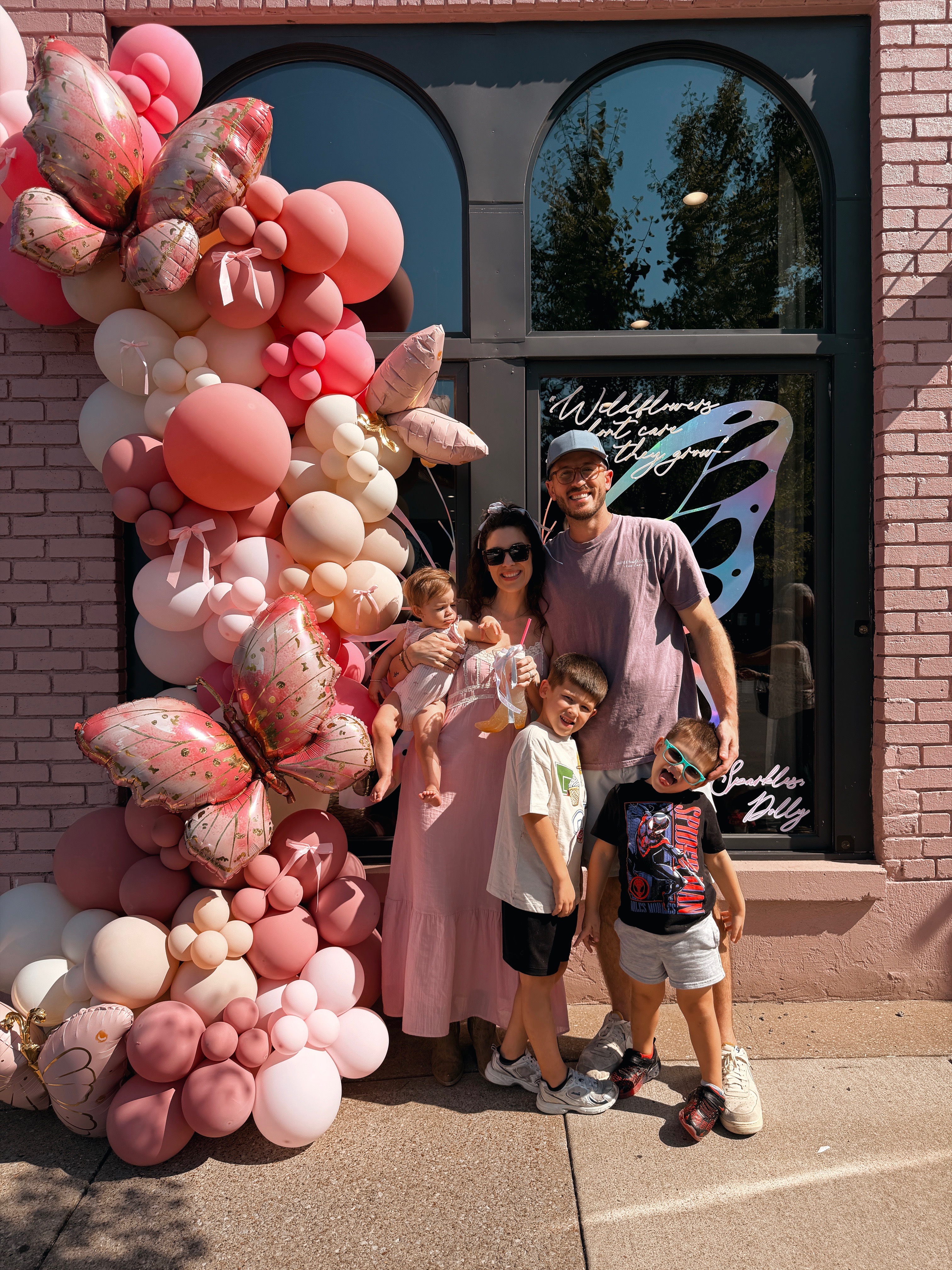 The Bibles and Coffee family celebrating outside the cafe